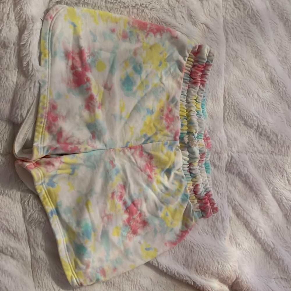 The brand is cat and jack, the size is kids large 10-12, the colors are multi